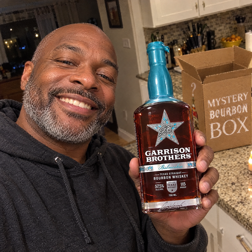 Holding up a bottle from the box