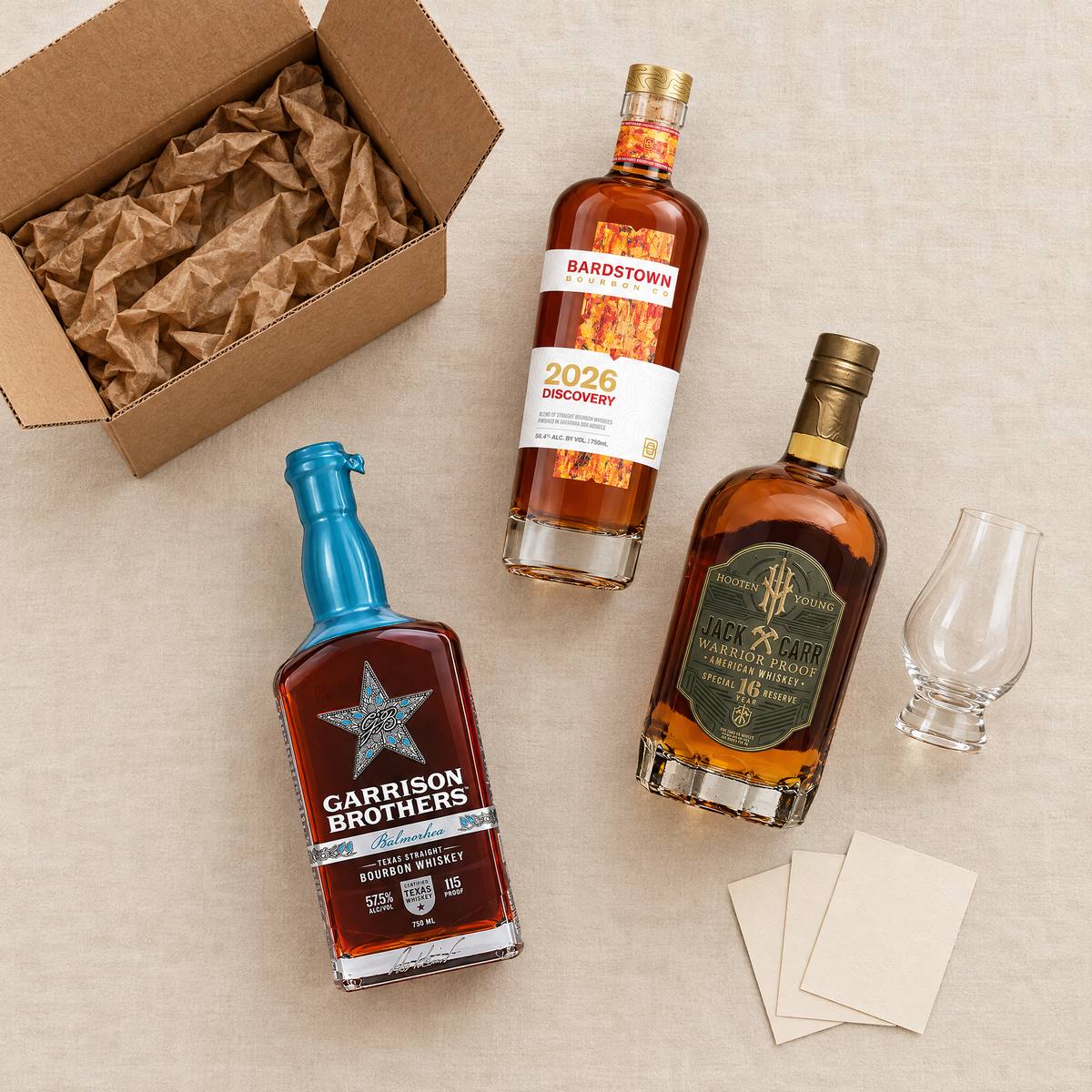 What arrives: the box, three bottles, tasting cards and a glass