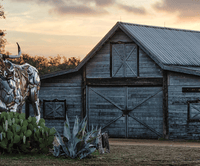 Garrison Brothers distillery barn at sunset in the Texas Hill Country