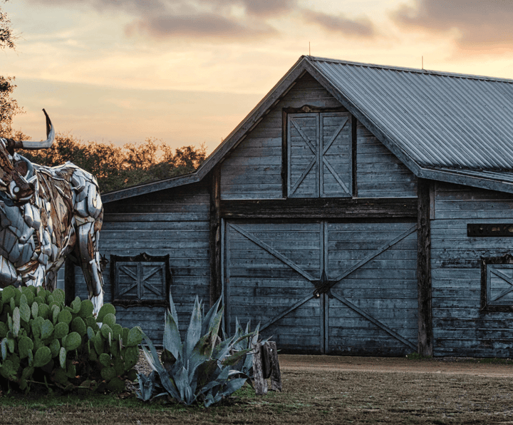 Garrison Brothers distillery barn at sunset in the Texas Hill Country